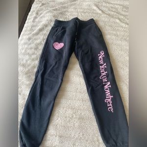 NYON black sweatpants with pink logo